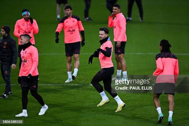 Manchester City's English midfielder Jack Grealish attends a team training session at Manchester City's training ground in north-west England on...