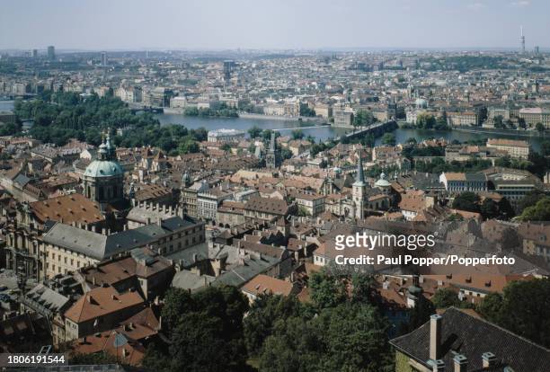 Aerial view of the Old Town and New Town districts and, on the far side of the Charles Bridge and the Vltava River, Lesser Town in the city of...