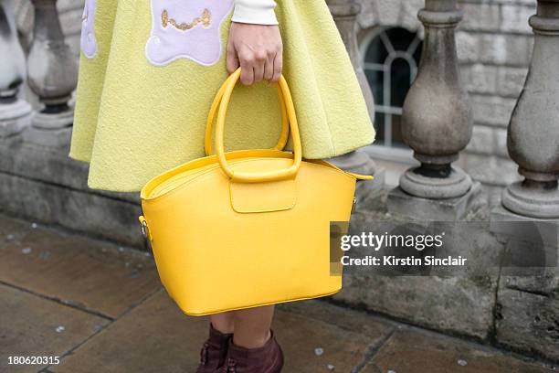 Photographer Sara Reverberi wears Portamento shoes and bag, Vivetta skirt on day 2 of London Fashion Week Spring/Summer 2013, at Somerset House on...