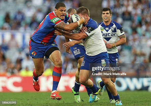 Willie Mason of the Knights is tackled during the NRL Elimination Final match between the Canterbury Bulldogs and the Newcastle Knights at ANZ...