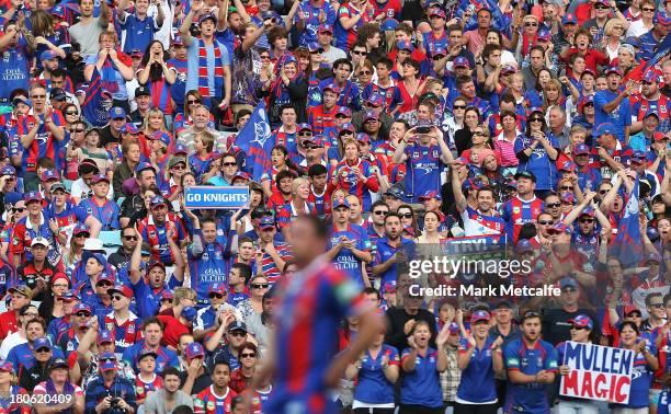 Knights fans celebrate a try during the NRL Elimination Final match between the Canterbury Bulldogs and the Newcastle Knights at ANZ Stadium on...