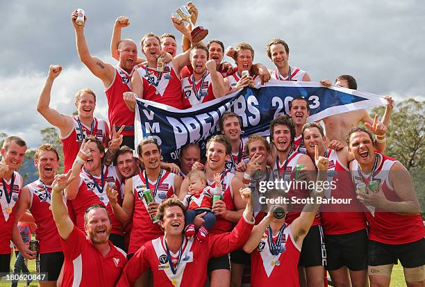 Healesville celebrate after being presented with the premiership flag and trophy after winning the Yarra Valley Mountain District Football League...