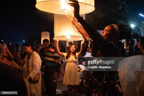 People release lanterns during Yi Peng Festival &amp; Loy Kratong in Doi Saket district of Chiang Mai, Thailand on November 27, 2023. In the north of...