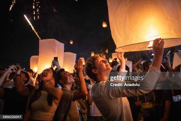 People release lanterns during Yi Peng Festival & Loy Kratong in Doi Saket district of Chiang Mai, Thailand on November 27, 2023. In the north of...