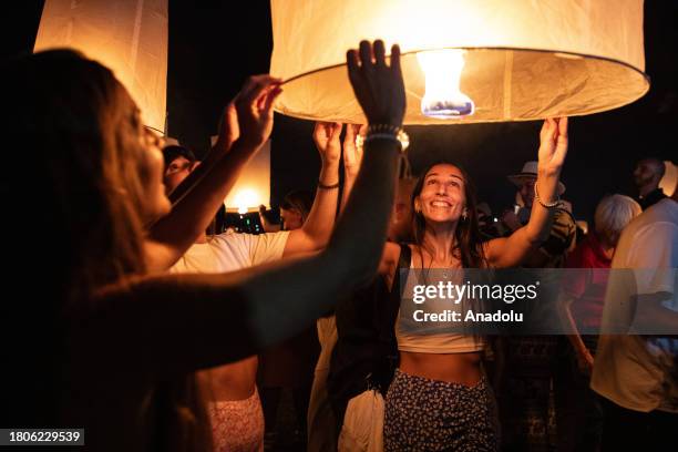 People release lanterns during Yi Peng Festival & Loy Kratong in Doi Saket district of Chiang Mai, Thailand on November 27, 2023. In the north of...