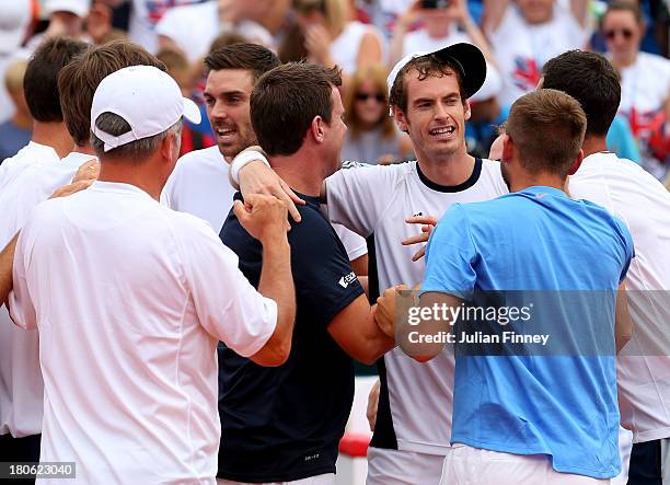 Andy Murray of Great Britain is congratulated by team mates after winning against Ivan Dodig of Croatia during day three of the Davis Cup World Group...