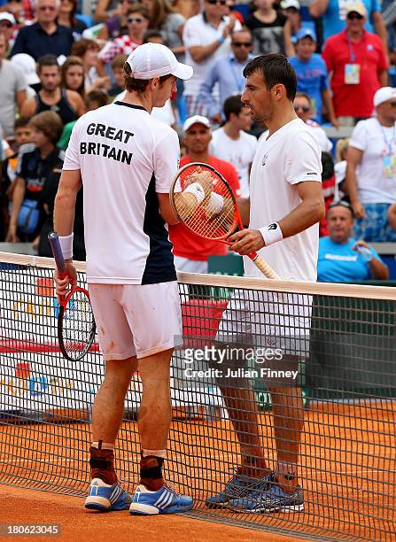 Andy Murray of Great Britain is congratulated by Ivan Dodig of Croatia after the match during day three of the Davis Cup World Group play-off tie...