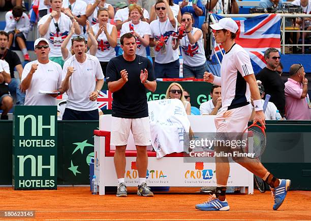 Andy Murray of Great Britain is supported by Captain Leon Smith in his match against Ivan Dodig of Croatia during day three of the Davis Cup World...