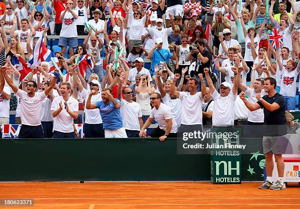 Team GB led by Captain Leon Smith celebrate Andy Murray of Great Britain defeating Ivan Dodig of Croatia during day three of the Davis Cup World...