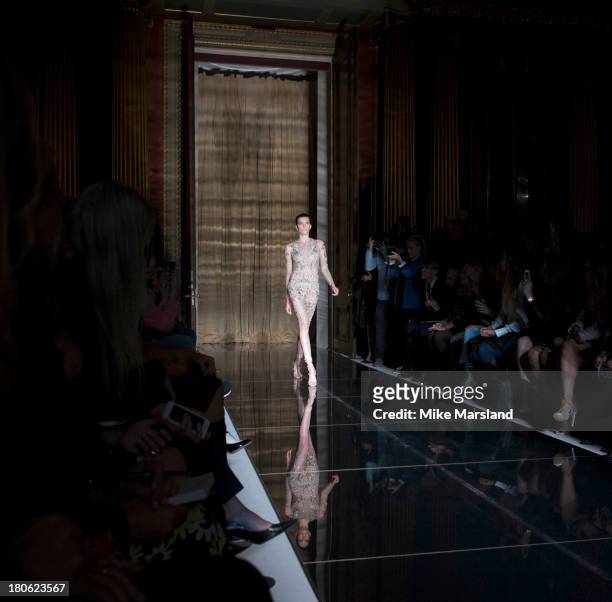 Model walks the runway at the Julien Macdonald show during London Fashion Week SS14 on September 14, 2013 in London, England.