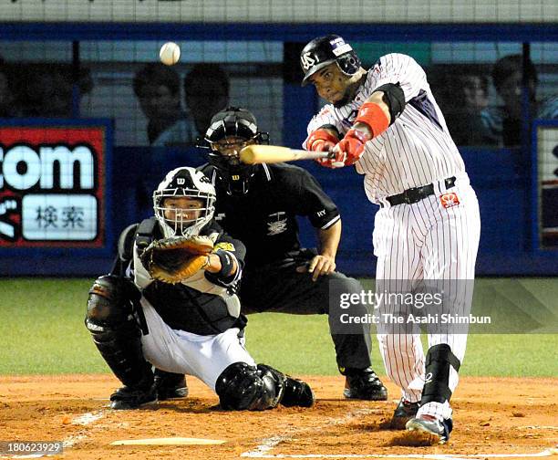 Wladimir Balentien of Yakult Swallows hits a two-run homer, new record of 56th of the season, in the bottom of first inning against Hanshin Tigers at...