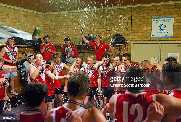 Healesville players celebrate in the changing rooms after winning the Yarra Valley Mountain District Football League Division 2 Seniors Grand Final...