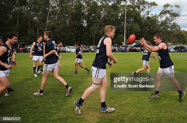 Seville players warm up before the Yarra Valley Mountain District Football League Division 2 Seniors Grand Final between Healesville and Seville at...