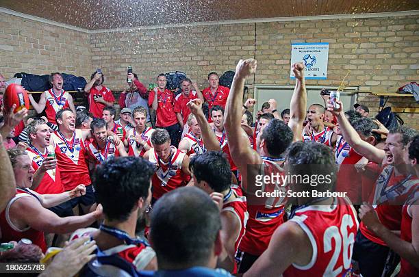 Healesville players celebrate in the changing rooms after winning the Yarra Valley Mountain District Football League Division 2 Seniors Grand Final...