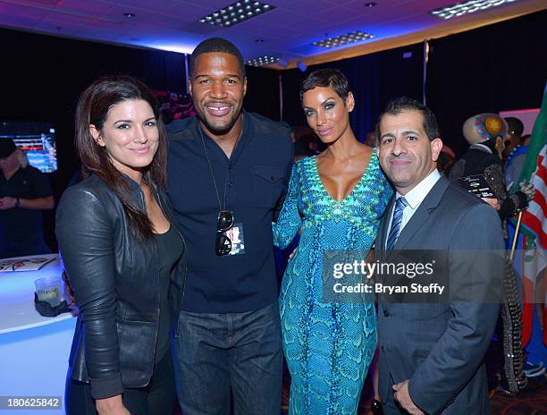 Actress and former mixed martial artist Gina Carano, former NFL player and current talk show host Michael Strahan, TV personality Nicole Murphy and...