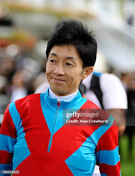 Yutaka Take poses at Longchamp racecourse on September 15, 2013 in Paris, France.