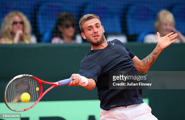 Daniel Evans of Great Britain in action against Mate Pavic of Croatia during day three of the Davis Cup World Group play-off tie between Croatia and...