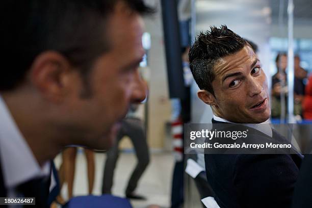 Crsitiano Ronaldo speaks with his agent Jorge Mendes after his signing contract renewal For Real Madrid at Estadio Santiago Bernabeu on September 15,...