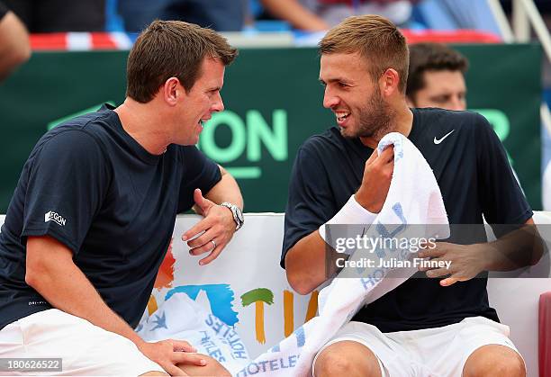 Daniel Evans of Great Britain with captain Leon Smith in his match against Mate Pavic of Croatia during day three of the Davis Cup World Group...