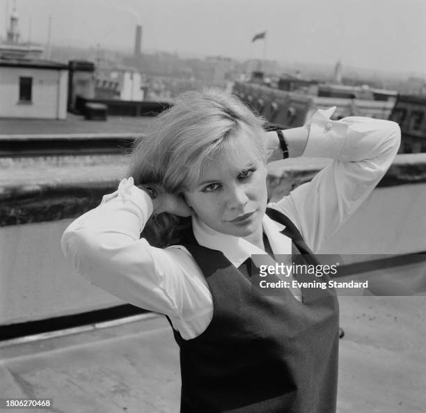 Joanna Dunham posing with her hands in her hair, June 24th 1961.