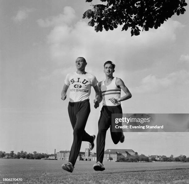 Middle-distance runner Mike Wiggs left, and long-distance runner Gordon Pirie during a training run, June 24th 1961.