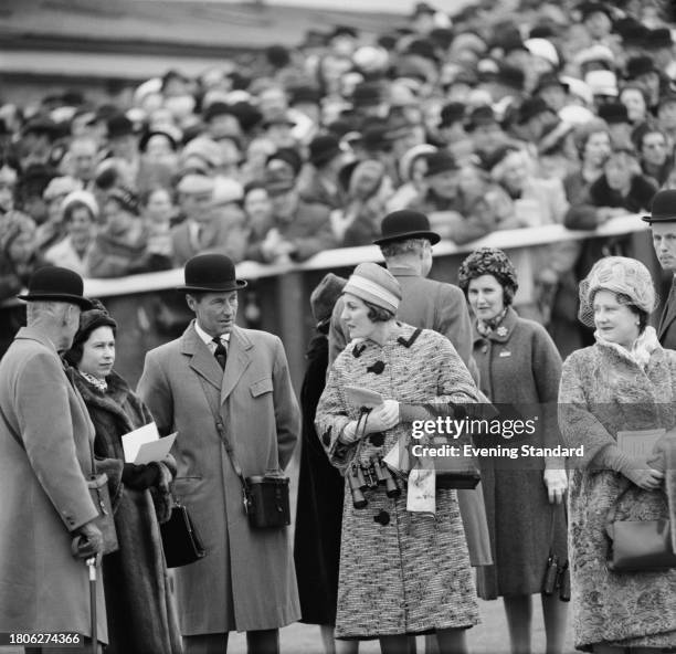 Queen Elizabeth II second left, Elizabeth The Queen Mother first right, attend the Gold Cup race meeting with Charles McLaren, 3rd Baron Aberconway...