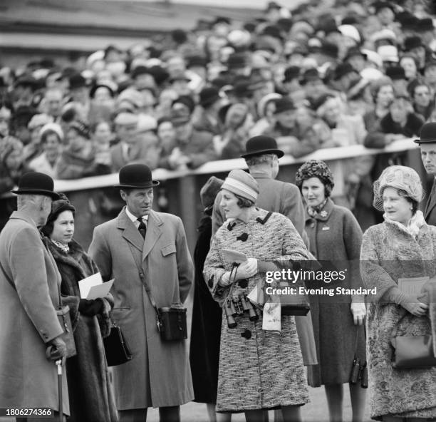 Queen Elizabeth II second left, Elizabeth The Queen Mother first right, attend the Gold Cup race meeting with Charles McLaren, 3rd Baron Aberconway...