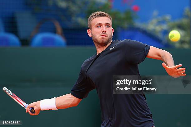 Daniel Evans of Great Britain in action against Mate Pavic of Croatia during day three of the Davis Cup World Group play-off tie between Croatia and...