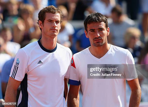 Andy Murray of Great Britain lines up next to Ivan Dodig of Croatia before their match during day three of the Davis Cup World Group play-off tie...