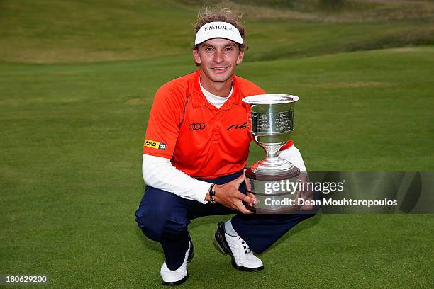 Joost Luiten of Netherlands celebrates with the Trophy after winning the KLM Open at Kennemer G & CC on September 15, 2013 in Zandvoort, Netherlands.