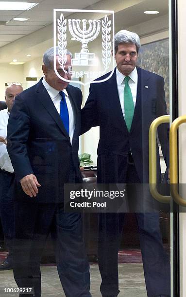 United States Secretary of State John Kerry and Israeli Prime Minister Benjamin Netanyahu as they walk out from their lengthly meeting in the prime...