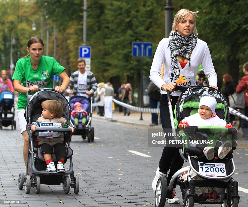 Pram Racing Parents push their children in prams as they participate in a 500m ...