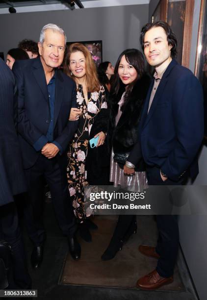 Mario Testino, guest, Ching He Huang and Jamie Chung attend a private view of Mario Testino's new exhibition 'Gone Wild' at Hamiltons Gallery on...