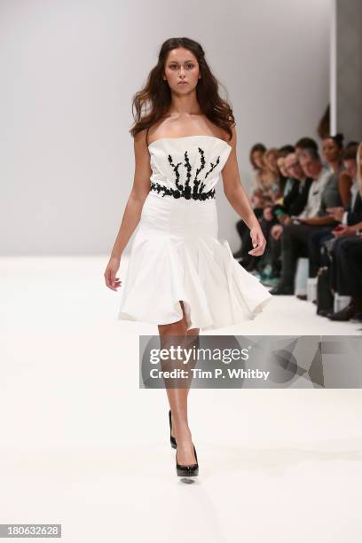 Model walks the runway at the House Of Evolution show at the Fashion Scout venue during London Fashion Week SS14 at Freemasons Hall on September 15,...