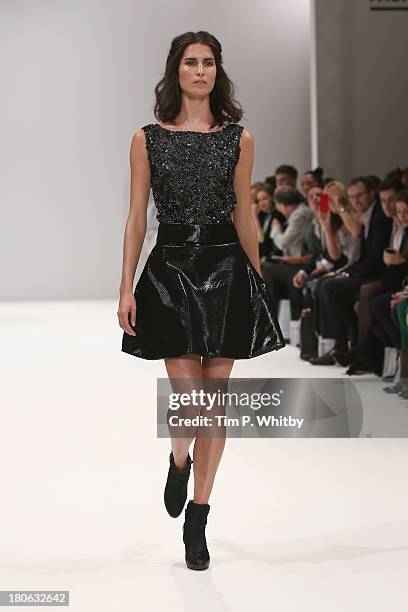 Model walks the runway at the House Of Evolution show at the Fashion Scout venue during London Fashion Week SS14 at Freemasons Hall on September 15,...