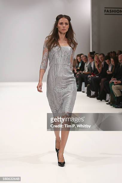 Model walks the runway at the House Of Evolution show at the Fashion Scout venue during London Fashion Week SS14 at Freemasons Hall on September 15,...
