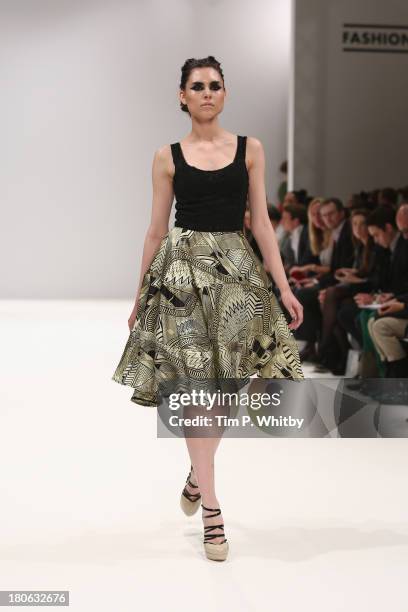 Model walks the runway at the House Of Evolution show at the Fashion Scout venue during London Fashion Week SS14 at Freemasons Hall on September 15,...