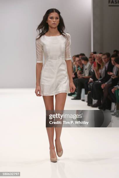 Model walks the runway at the House Of Evolution show at the Fashion Scout venue during London Fashion Week SS14 at Freemasons Hall on September 15,...