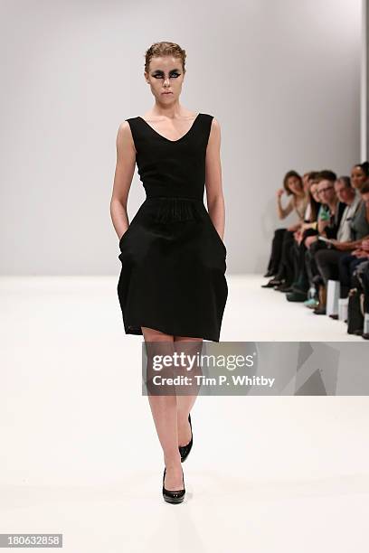 Model walks the runway at the House Of Evolution show at the Fashion Scout venue during London Fashion Week SS14 at Freemasons Hall on September 15,...