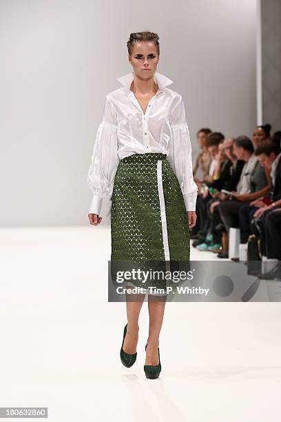 Model walks the runway at the House Of Evolution show at the Fashion Scout venue during London Fashion Week SS14 at Freemasons Hall on September 15,...