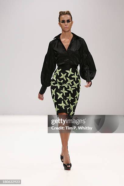 Model walks the runway at the House Of Evolution show at the Fashion Scout venue during London Fashion Week SS14 at Freemasons Hall on September 15,...