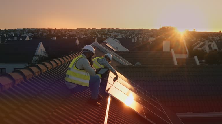 https://media.gettyimages.com/id/1806330808/video/solar-panels-installation-and-men-on-roof-or-house-with-tools-tablet-or-energy-saving.jpg?b=1&s=640x640&k=20&c=RFC6TySB6ysFjrG4rkkn_9DAn7lfrjg8njG2m7tfQsE=