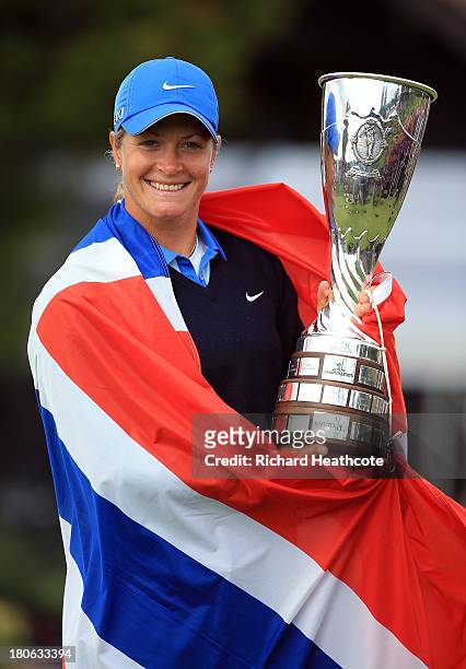 Suzann Pettersen of Norway holds the trophy after securing victory in the third round of The Evian Championship at the Evian Resort Golf Club on...