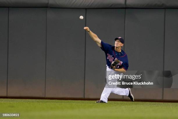 Clete Thomas of the Minnesota Twins fields a ball hit by the Toronto Blue Jays on September 6, 2013 at Target Field in Minneapolis, Minnesota. The...