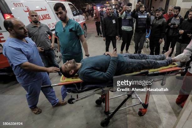 Palestinians injured in Israeli raids arrive at Nasser Medical Hospital on November 21, 2023 in Khan Yunis, Gaza. More Gaza residents have fled south...