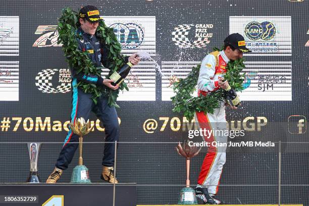 Luke Browning of Great Britain and Hitech Pulse-Eight and Gabriele Mini of Italy and SJM Theodore PREMA Racing celebrate on the podium during the...