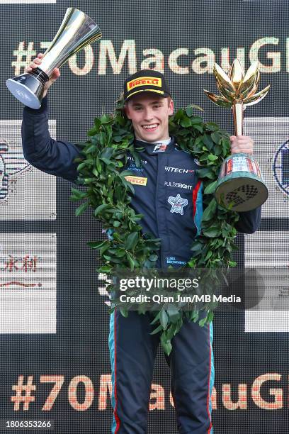 Luke Browning of Great Britain and Hitech Pulse-Eight celebrates his win on the podium during the Formula 3 Macau Grand Prix FIA F3 World Cup as part...