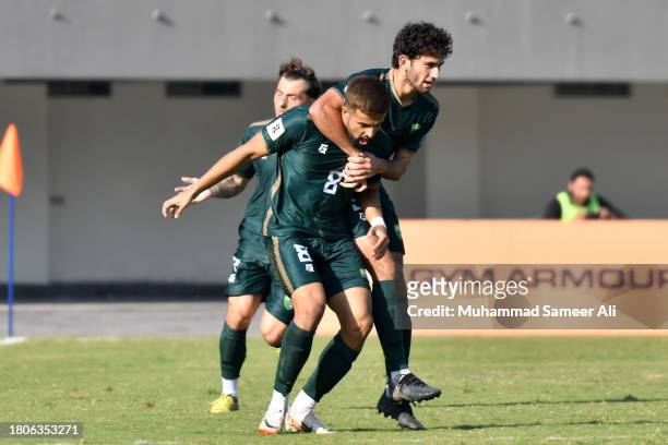 Rahis Nabi of Pakistan is grabbed by his teammate Mohib Ullah during celebrations at the 2026 FIFA World Cup AFC Qualifier Group G match between...