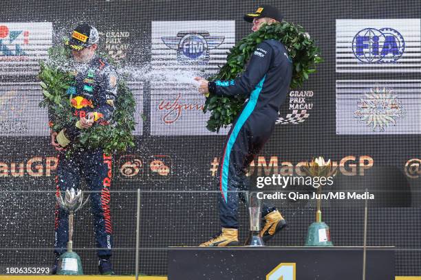 Luke Browning of Great Britain and Hitech Pulse-Eight and Dennis Hauger of Norway and MP MOTORSPORT celebrate on the podium during the Formula 3...