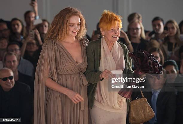 Model Lily Cole and designer Dame Vivienne Westwood stand on stage after the Vivienne Westwood Red Label show during London Fashion Week SS14 at the...